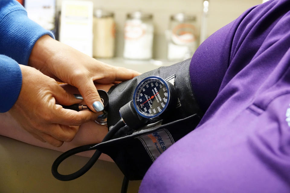 A nurse takes someones blood pressure inside the East Arkansas Family Health Center in Lepanto, Arkansas, U.S., May 2, 2018. Picture taken May 2, 2018.    To match Special Report USA-HEALTHCARE/ARKANSAS     REUTERS/Karen Pulfer Focht