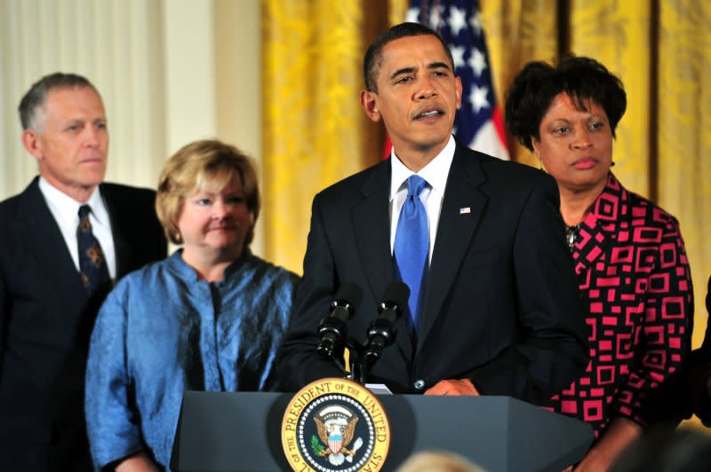 President Barack Obama (2nd-R) delivers remarks on the passing of the Matthew Shepard Hate Crimes Prevention Act, at the White House in Washington on October 28, 2009. The bill expands upon 1969 U.S. federal hate-crime law by extending its scope to protect crimes motivated by a victim's gender, disability, sexual orientation or gender identity. Obama was joined by Dennis (L) and Judy (2nd-L) Shepard, the parents of Matthew Shepard, and Louvon Harris the sister of James Byrd Jr., both of who were victims of hate crimes. Matthew Shepard died October 12, 1998. File Photo by Kevin Dietsch/UPI