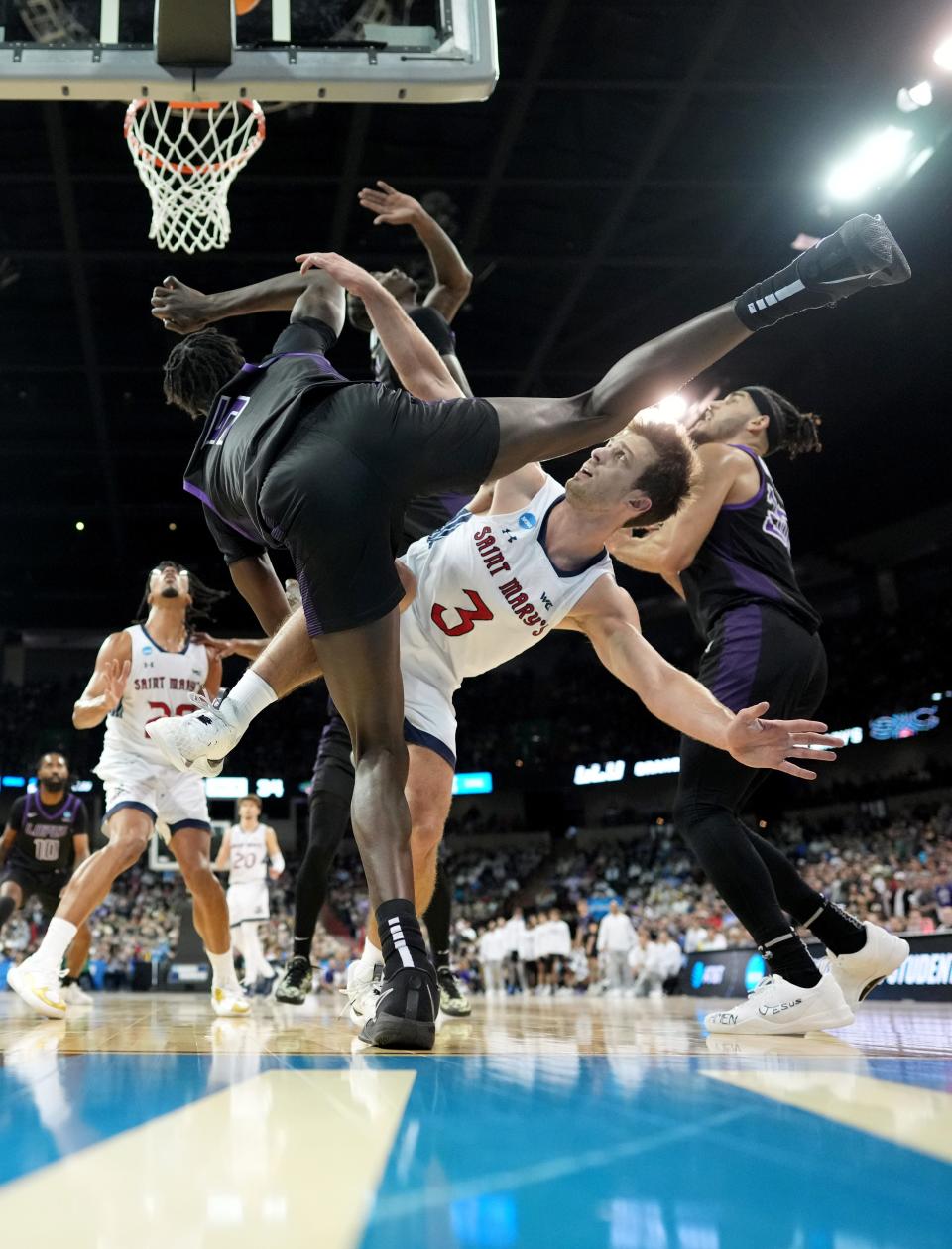 Mar 22, 2024; Spokane, WA, USA; Grand Canyon Antelopes forward Lok Wur (5) and St. Mary's Gaels guard Augustas Marciulionis (3) fight for a rebound during the second half in the first round of the 2024 NCAA Tournament at Spokane Veterans Memorial Arena. Mandatory Credit: Kirby Lee-USA TODAY Sports