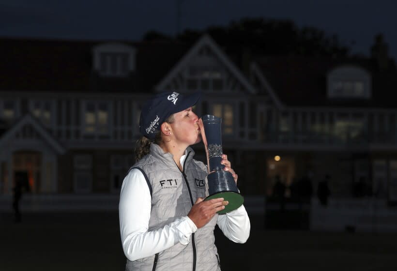 South Africa's Ashleigh Buhai kisses the trophy after winning the Women's British Open in Muirfield, Scotland on Sunday.
