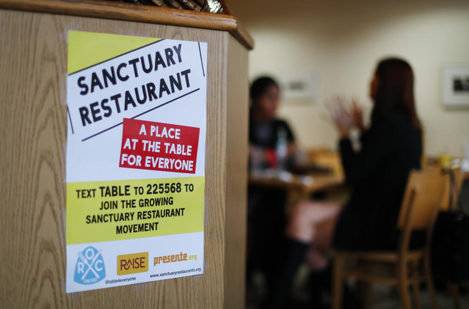 <p> In this Wednesday, Jan. 18, 2017 photo, a sanctuary restaurant sign is shown at Russell Street Deli in Detroit. Dozens of restaurants are seeking “sanctuary” status, a designation owners hope will help protect employees in an immigrant-heavy industry and tone down fiery rhetoric sparked by the presidential campaign. (AP Photo/Paul Sancya) </p>