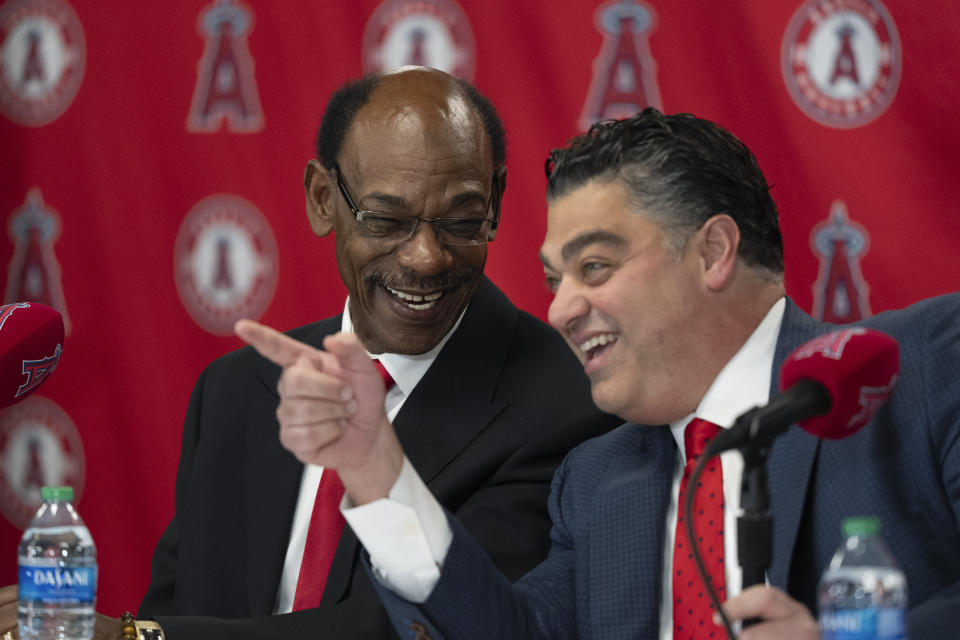Ron Washington, left, the new manager of the Los Angeles Angels, and general manager Perry Minasian share a light moment during a news conference Wednesday, Nov. 15, 2023, in Anaheim, Calif. The 71-year-old Washington managed the Texas Rangers from 2007-14, winning two AL pennants and going 664–611. (AP Photo/Jae C. Hong)
