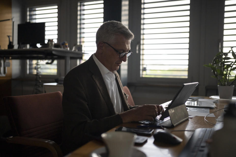 United Nations High Commissioner for Refugees Filippo Grandi works at UNHCR headquarters before an interview with The Associated Press, in Geneva, Switzerland, Wednesday, Aug. 17, 2022. Grandi said Europe's embrace of millions of Ukrainians who fled Russia's invasion showed that it's possible to welcome large numbers of asylum-seekers, and the approach should be replicated to receive those fleeing other nations. (AP Photo/Renata Brito)