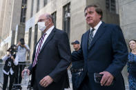 The Trump Organization's former Chief Financial Officer Allen Weisselberg, left, departs court, Friday, Aug. 12, 2022, in New York. Capping an extraordinary week in Donald Trump’s post-presidency, a New York judge ordered Friday that his company and its longtime finance chief stand trial in the fall on tax fraud charges stemming from a long-running criminal investigation into Trump’s business practices. (AP Photo/John Minchillo)