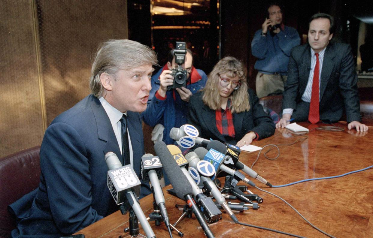 Real estate mogul Donald Trump talks to reporters during a news conference in New York, on Feb. 13, 1992. Trump proposed that former world heavyweight boxing champion Mike Tyson be allowed to give 