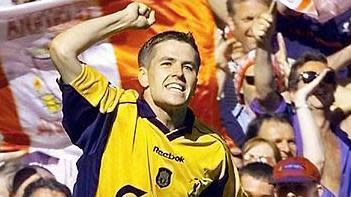 Michael Owen celebrates scoring against Arsenal