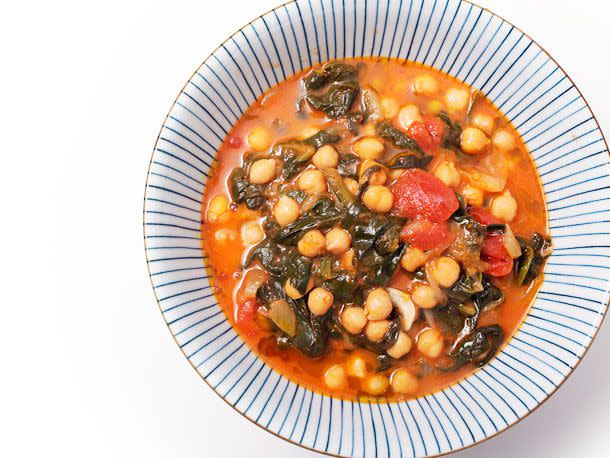 <p>Garbanzos con espinacas, the Spanish stew upon which this stew is based, usually relies on smoky chorizo or rich morcilla (blood sausage) for its flavor. This vegan version keeps those bold flavors by simmering the chickpeas and their liquid with aromatics like garlic, onion, bay leaf, ginger, and smoked paprika.</p> 
<p><strong><a href="https://www.seriouseats.com/vegan-garbanzos-con-espinacas-jengibre-spinach-chickpea-stew-ginger-spanish" target="_blank">Get the recipe! »</a></strong></p> 
<p class="caption">[Photograph: J. Kenji Lopez-Alt]</p>