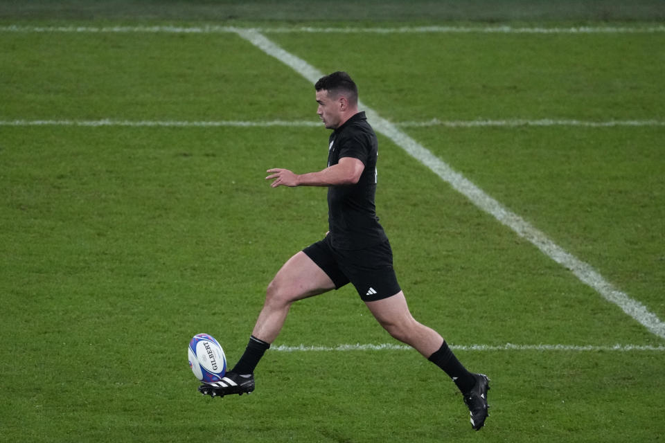 New Zealand's Will Jordan kicks the ball forward before scoring a try during the Rugby World Cup semifinal match between Argentina and New Zealand at the Stade de France in Saint-Denis, outside Paris, Friday, Oct 20, 2023. (AP Photo/Themba Hadebe)