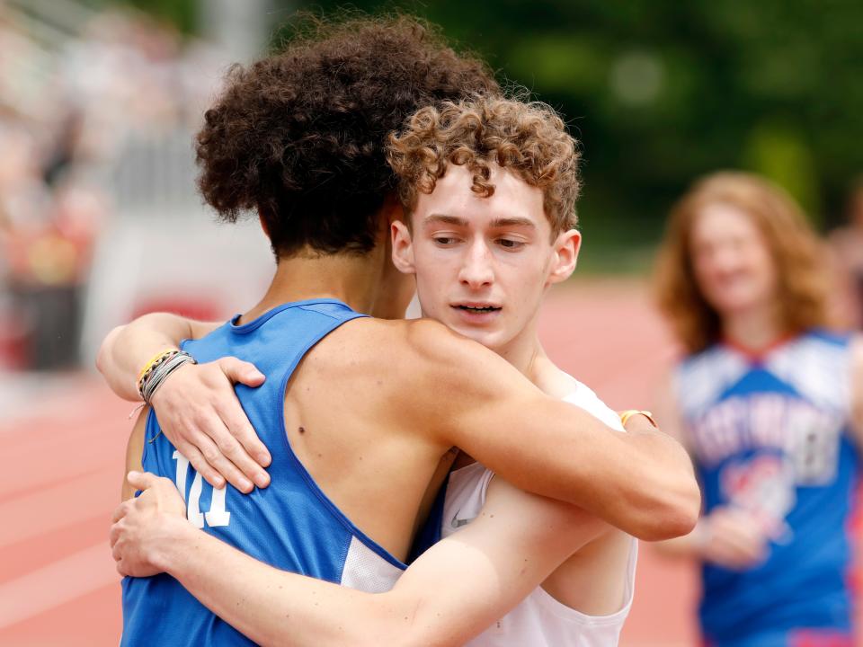 Zane Trace's Wyatt Vick, left, gives Westfall's Josh Trapp a hug following the 800 meters at the Division II regional track and field meet on Saturday at McConagha Stadium in New Concord. The top four finishers in each event advanced to the state meet on June 2-3 at Ohio State's Jesse Owens Memorial Stadium in Columbus.