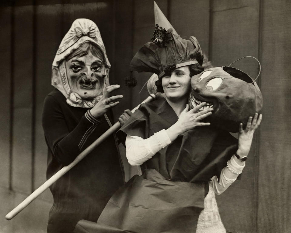 <p>Two witches are ready for a Halloween party in the early twentieth century.</p>