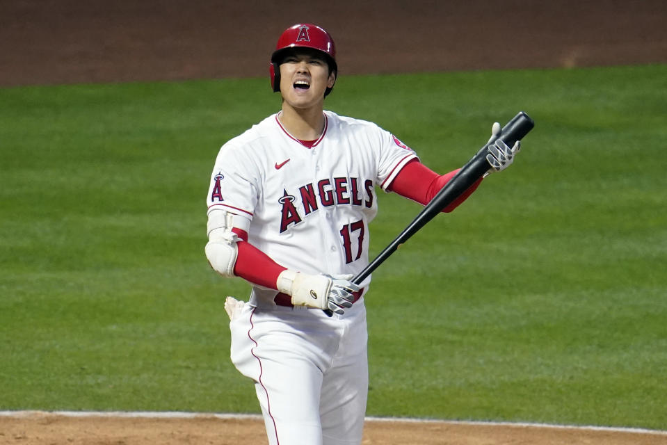 Los Angeles Angels' Shohei Ohtani reacts as he hits a foul ball during the third inning of a baseball game against the Tampa Bay Rays Monday, May 3, 2021, in Anaheim, Calif. (AP Photo/Marcio Jose Sanchez)