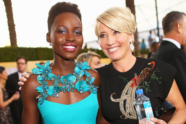 <p>Christopher Polk/WireImage</p> Lupita Nyong'o and Emma Thompson on Jan. 18, 2014