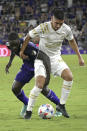 Orlando City forward Benji Michel, left, and Atlanta United forward Erik Lopez compete for a ball during the second half of an MLS soccer match, Friday, July 30, 2021, in Orlando, Fla. (Phelan M. Ebenhack/Orlando Sentinel via AP)