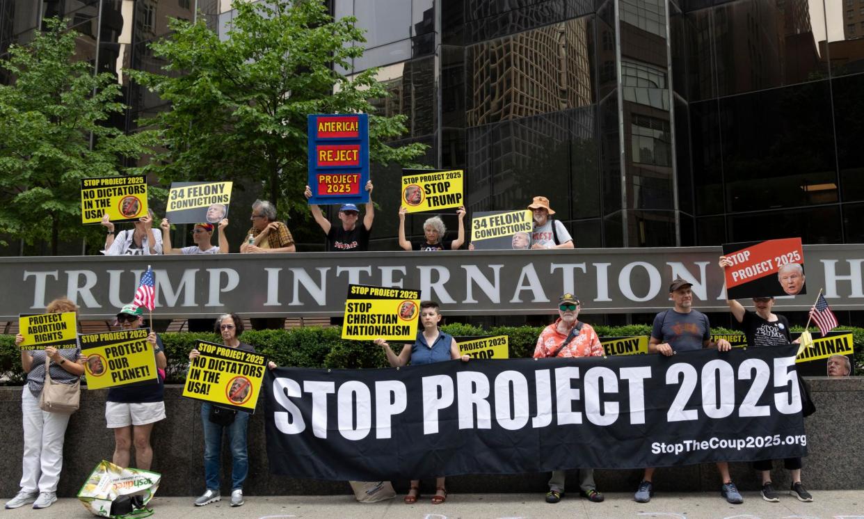 <span>Anti-Trump protesters with the activist group Rise & Resist hold signs and banners outside of Trump International Hotel & Tower, on 20 July 2024.</span><span>Photograph: Gina M Randazzo/Zuma Press Wire/Rex/Shutterstock</span>