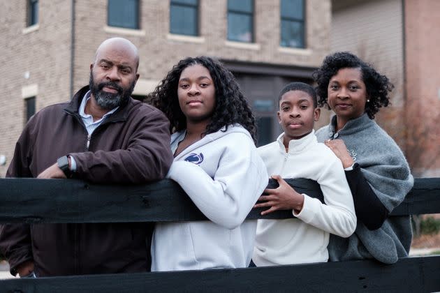 Katrece Nolen, at right, stands for a portrait with family on Nov. 20 in Chantilly, Virginia. Nolen is a mother of two children currently attending Loudoun County Public Schools. (Photo: Michael A. McCoy for HuffPost)