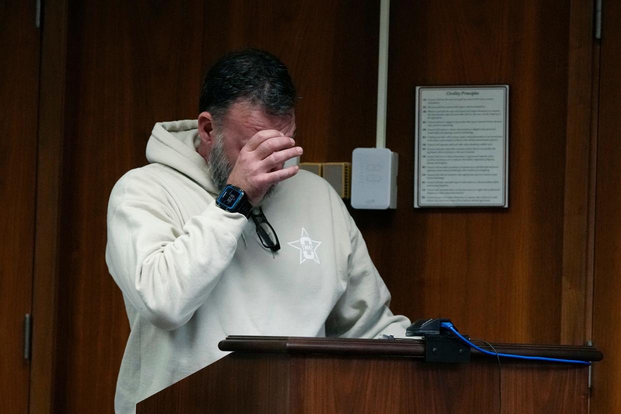 Buck Myre, the father of Tate Myre, wipes his eyes as he gives his victim impact statement, Friday, Dec. 8, 2023, in Pontiac, Mich. Parents of students killed at Michigan's Oxford High School described the anguish of losing their children Friday as a judge considered whether Ethan Crumbley, a teenager, will serve a life sentence for a mass shooting in 2021.