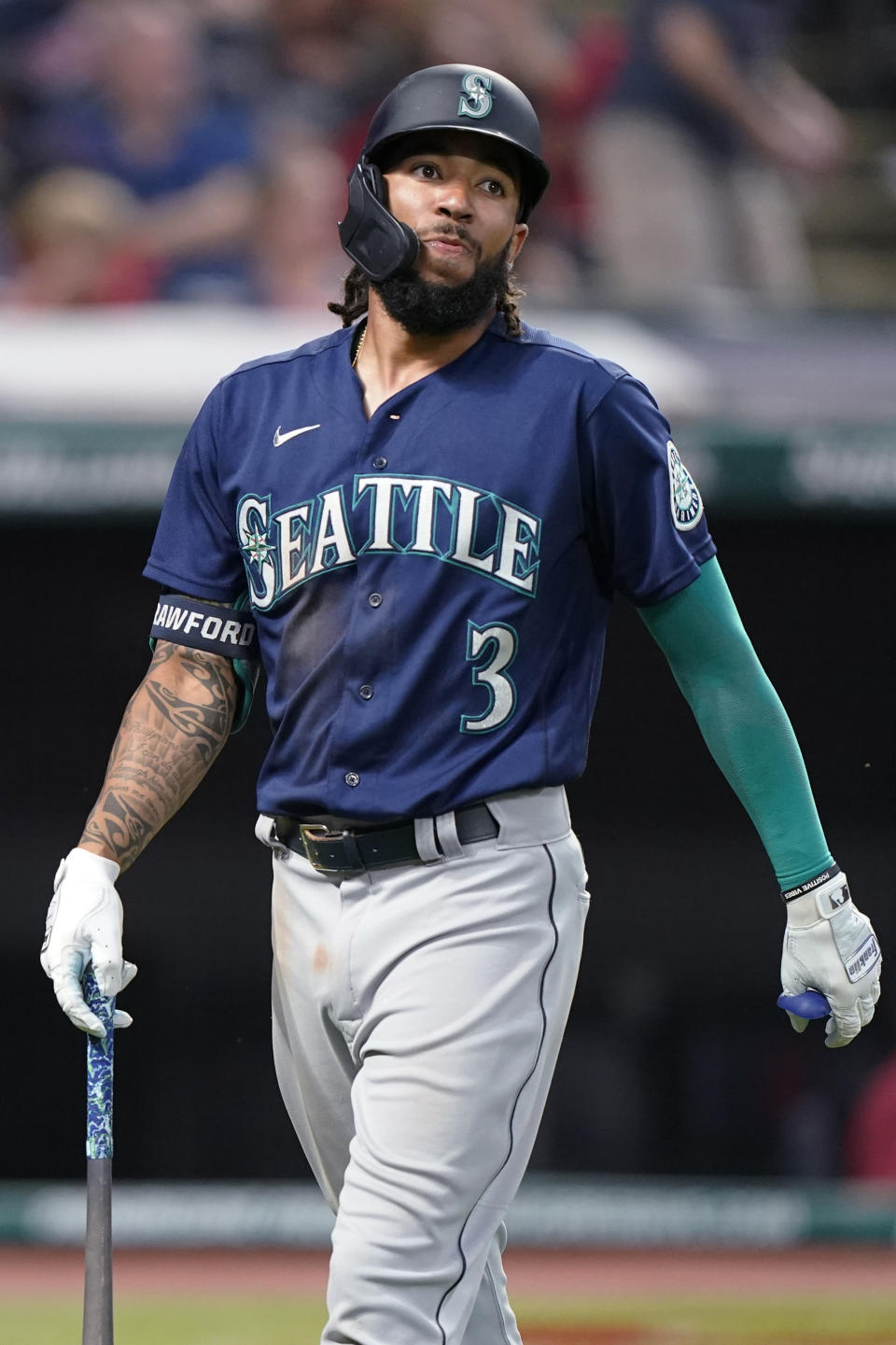 Seattle Mariners' J.P. Crawford reacts after striking out in the sixth inning of the team's baseball game against the Cleveland Indians, Friday, June 11, 2021, in Cleveland. (AP Photo/Tony Dejak)