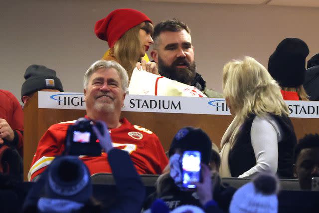 <p>Al Bello/Getty Images</p> Taylor Swift and Jason Kelce #62 of the Philadelphia Eagles talk in a suite as fans take pictures prior to the AFC Divisional Playoff between the Kansas City Chiefs and the Buffalo Bills game