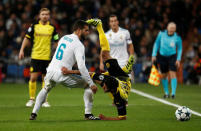 Soccer Football - Champions League - Real Madrid vs Borussia Dortmund - Santiago Bernabeu, Madrid, Spain - December 6, 2017 Borussia Dortmund’s Mahmoud Dahoud in action with Real Madrid’s Nacho REUTERS/Juan Medina