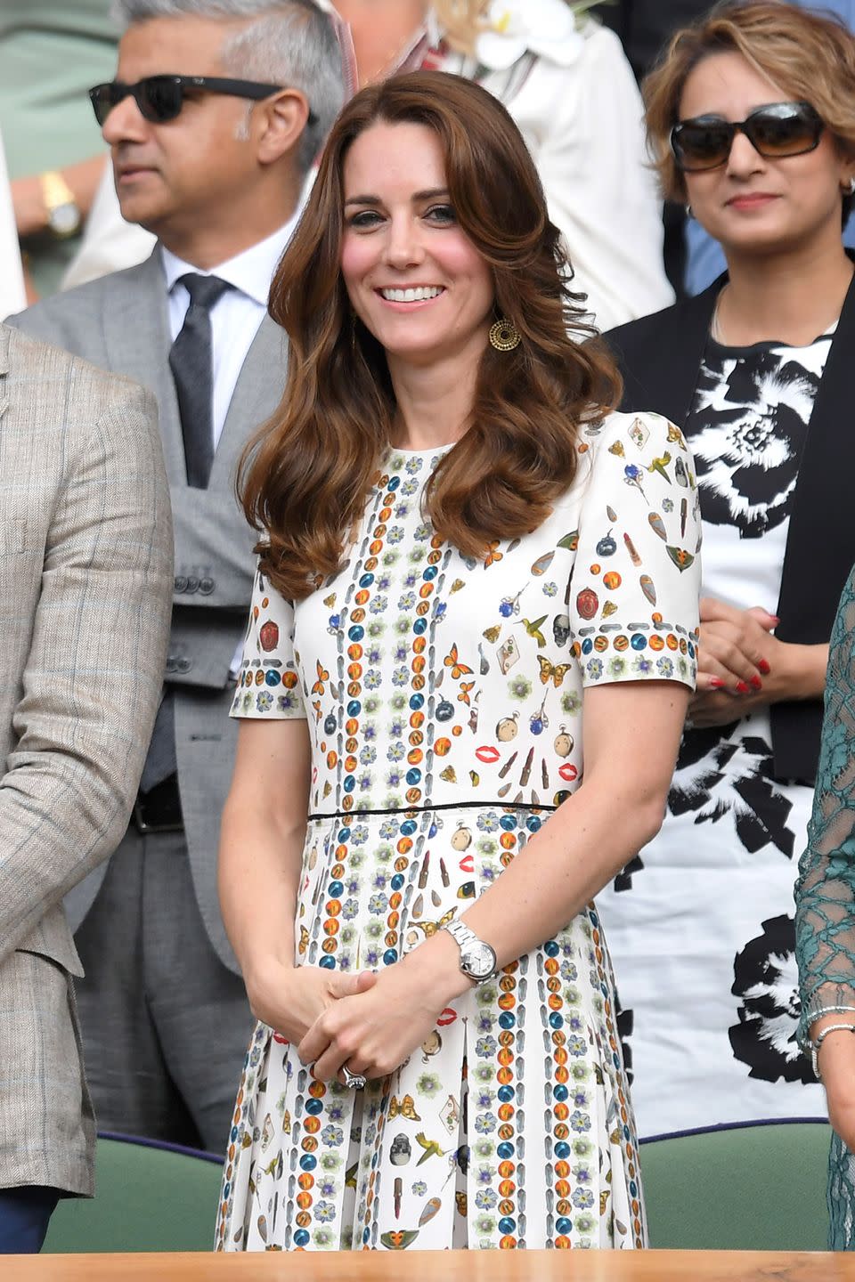 <p>The Duchess wore an Alexander McQueen printed midi dress, gold pendant earrings and a silver watch to the Wimbledon men's final. </p>