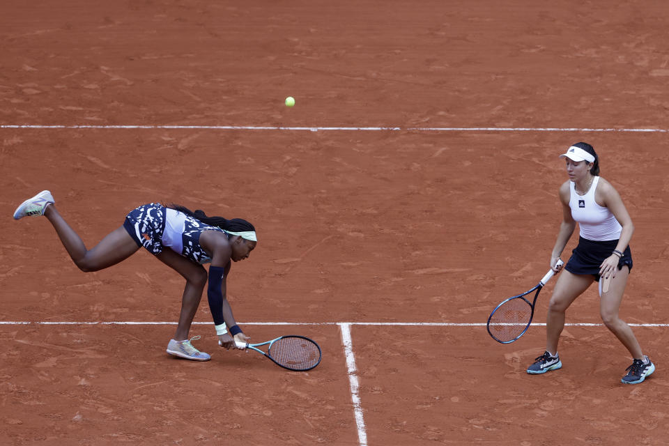 Coco Gauff of the U.S., left, and Jessica Pegula of the U.S. return the ball to France's Caroline Garcia and France's Kristina Mladenovic during their women doubles final match of the French Open tennis tournament at the Roland Garros stadium Sunday, June 5, 2022 in Paris. (AP Photo/Jean-Francois Badias)
