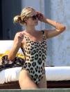 <p>Paris Hilton wears a leopard-print one-piece as she takes a dip in the pool of her luxury resort in Cabo San Lucas, Mexico on Saturday.</p>