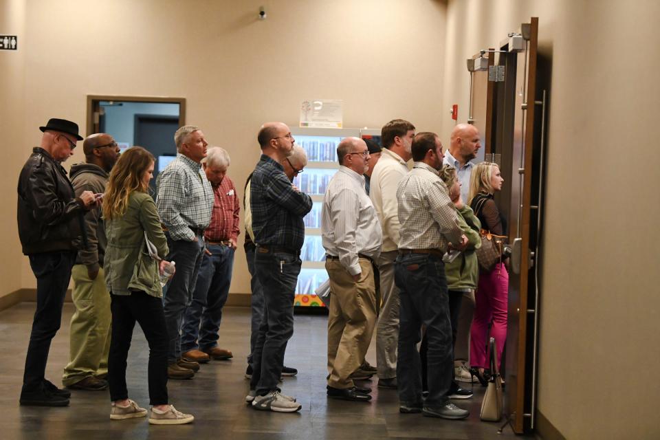 Feb 19, 2024; Northport, Alabama, USA; Citizens attending a public meeting on the proposed University Beach LLC waterpark development look in from the hallway. Citizens filled the council chamber, overflowed into the hallways, and filled a remote viewing room.