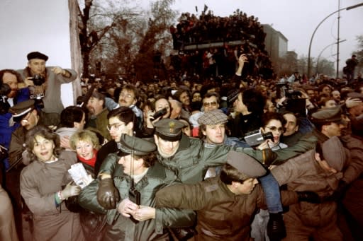 East and West German police struggled to contain the crowds of East Berliners flowing through an opening made in the wall at Potsdamer Square