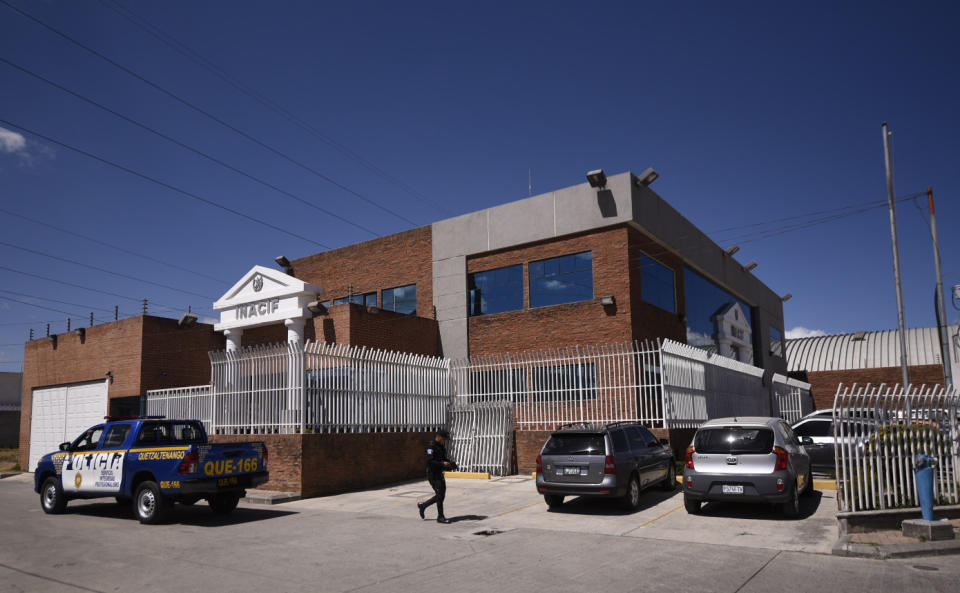 A police officer walks outside the morgue where an autopsy is being performed on the body of English tourist Catherine Shaw in Quetzaltenango, Guatemala, Tuesday, March 12, 2019. The body of the 23-year-old who was found dead near a highland lake popular with travelers showed signs of trauma but no apparent gunshot or stab wounds, a doctor performing an autopsy said Tuesday. (AP Photo/Santiago Billy)