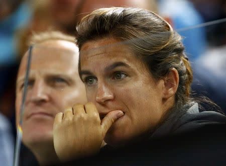 Amelie Mauresmo (R), coach of Britain's Andy Murray, reacts as she watches his third round match against Portugal's Joao Sousa at the Australian Open tennis tournament at Melbourne Park, Australia, January 23, 2016. REUTERS/Thomas Peter