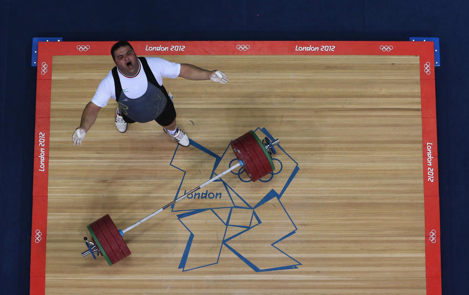 LONDON, ENGLAND - AUGUST 07: Sajjad Anoushiravani Hamlabad of Iran reacts during the Men's +105kg Weightlifting final on Day 11 of the London 2012 Olympic Games at ExCeL on August 7, 2012 in London, England. (Photo by Richard Heathcote/Getty Images)