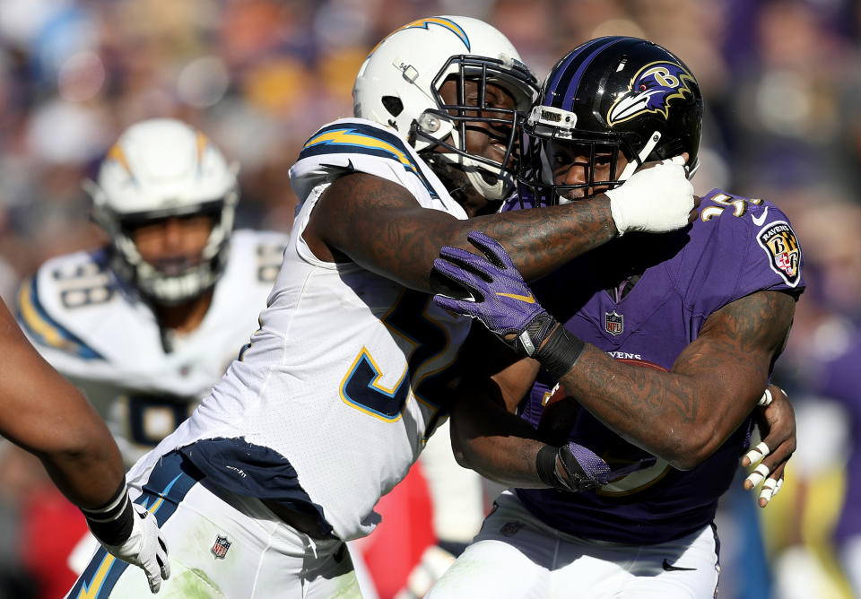 <p>Gus Edwards #35 of the Baltimore Ravens runs with the ball against the Los Angeles Chargers during the first quarter in the AFC Wild Card Playoff game at M&T Bank Stadium on January 06, 2019 in Baltimore, Maryland. (Photo by Patrick Smith/Getty Images) </p>