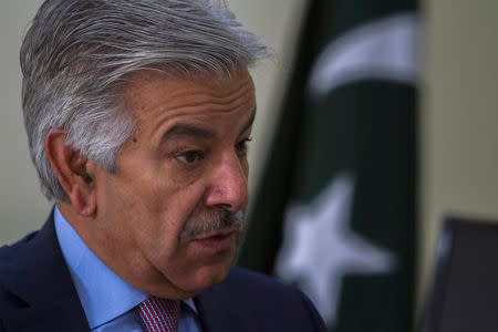 FILE PHOTO: Pakistan's Defence Minister Khawaja Asif speaks during an interview with Reuters at his office in Islamabad, Pakistan March 6, 2014. REUTERS/Faisal Mahmood/File Photo