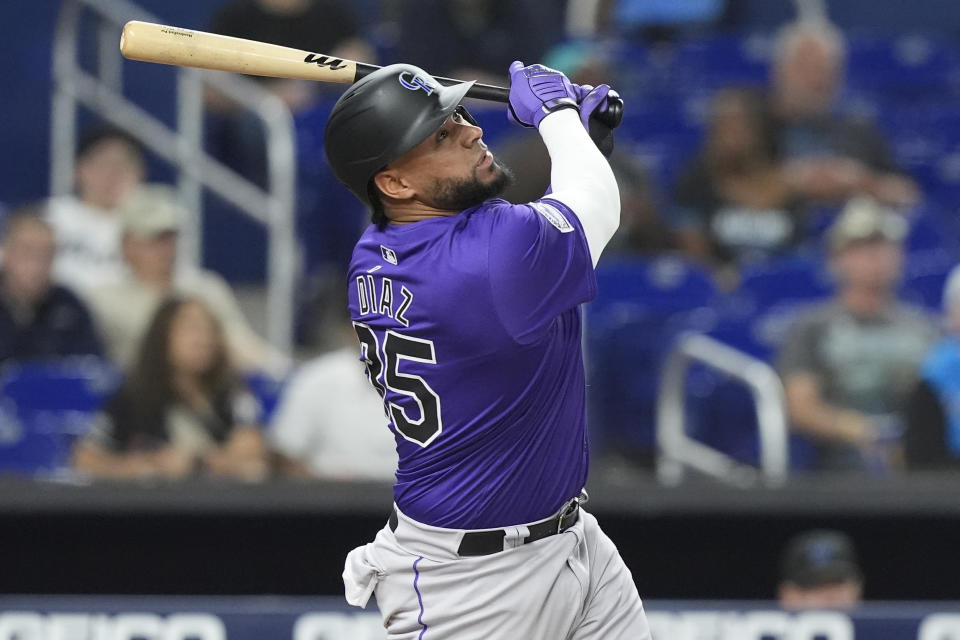 Colorado Rockies' Elias Díaz (35) hits a single to right field during the first inning of a baseball game against the Miami Marlins, Wednesday, May 1, 2024, in Miami. (AP Photo/Marta Lavandier)