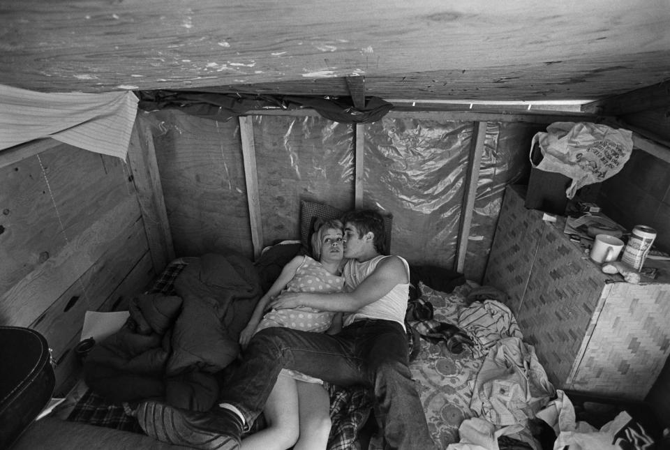 <p>Chris and the girl with the pink hair in Shantytown, NYC, 1986. (© Eugene Richards) </p>