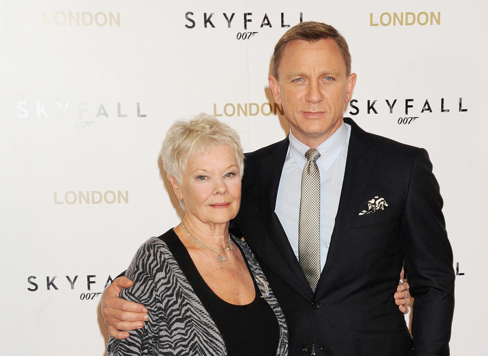 LONDON, ENGLAND - OCTOBER 22:  (EMBARGOED FOR PUBLICATION IN UK TABLOID NEWSPAPERS UNTIL 48 HOURS AFTER CREATE DATE AND TIME. MANDATORY CREDIT PHOTO BY DAVE M. BENETT/WIREIMAGE REQUIRED)   Dame Judi Dench (L) and Daniel Craig attend a photocall for the new James Bond film 'Skyfall' at The Dorchester on October 22, 2012 in London, England.  (Photo by Dave M. Benett/WireImage)