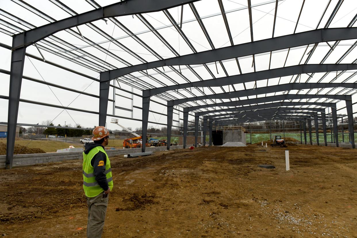 Michael Nalevanko, with Mike Coates Construction Co., walks through the new building being built for Canton's Sanitation Department. City utility rates, which are increasing March 31, will pay off the $10 million loan needed for the project.