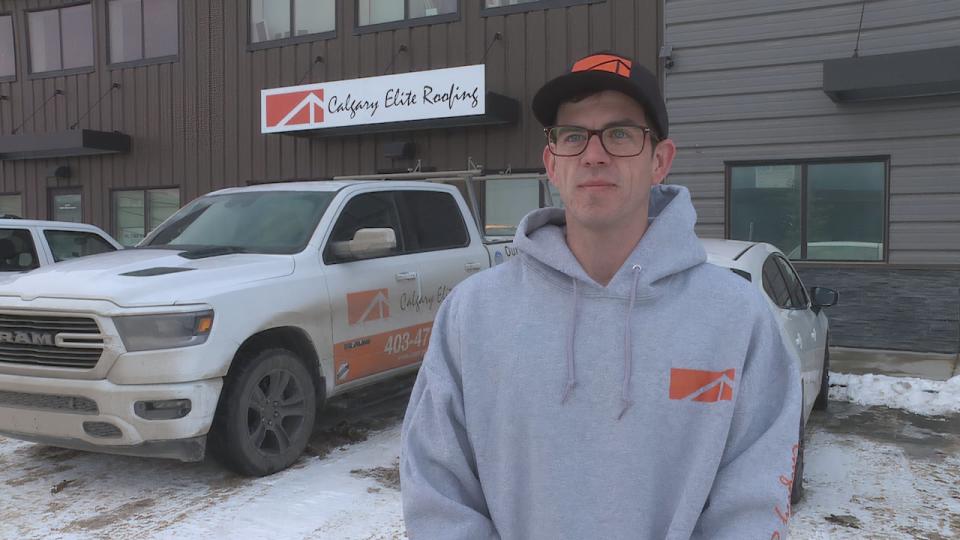 Cody Sager, a roofing technician with Calgary Elite Roofing, says his team has answered more than 30 distress calls over the past week from Calgary residents worried about attic rain. (Dave Gilson/CBC - image credit)