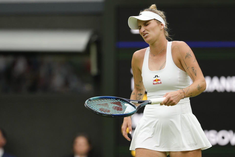 Marketa Vondrousova of the Czech Republic reacts during her first round match against Jessica Bouzas Maneiro of Spain at the Wimbledon tennis championships in London, Tuesday, July 2, 2024. (AP Photo/Kirsty Wigglesworth)