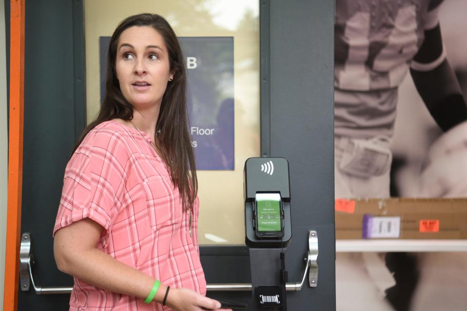 Executive Associate Athletics Director of External Operations, Alicia Longworth, demonstrates the new digital ticketing system in Neyland Stadium on University of Tennessee’s campus, Tuesday, Aug. 30, 2022.