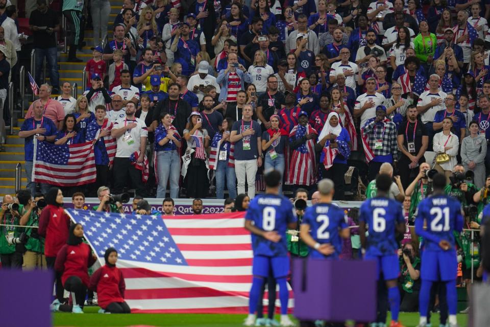US supporters sing the national anthem prior to the World Cup group B football match between England and The United States, at the Al Bayt Stadium in Al Khor, Qatar, Friday, Nov. 25, 2022. (AP Photo/Julio Cortez)