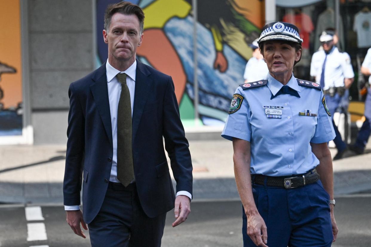 <span>Chris Minns and NSW police commissioner Karen Webb. The premier has expressed concern at the amount of misinformation and violent imagery on social media.</span><span>Photograph: Ayush Kumar/AFP/Getty Images</span>