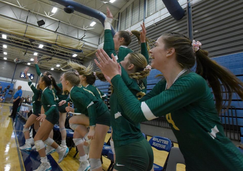 Jillian Anderson, Olivia Beaudrie and teammates of SMCC leap out of their chairs as they beat Plymouth Christian in 3 sets of the Division 3 Quarterfinals at Ypsilanti Lincoln High School Tuesday, November 14, 2023.