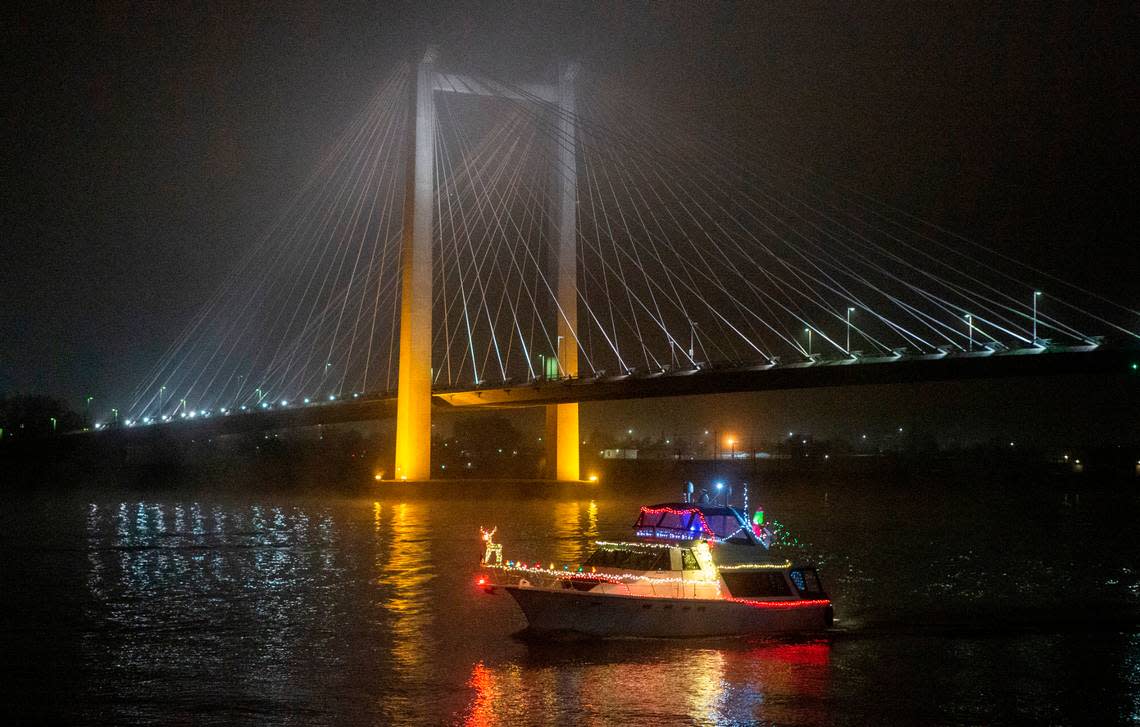 A dozen boats decked out with holiday lights cruise the Columbia River for the annual Lighted Boat Parade.