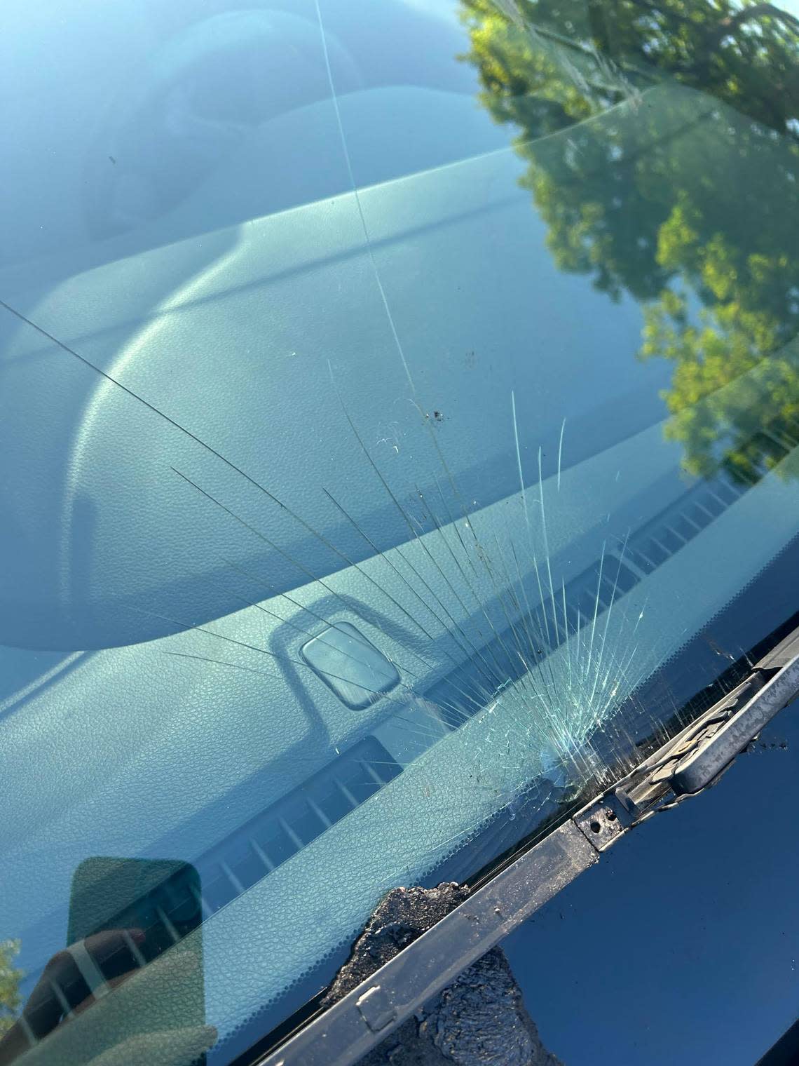 Debris from a truck on Florida’s Turnpike in Broward County shattered this car’s windshield.