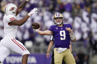 Washington quarterback Dylan Morris (9) throws against Arkansas State in the first half of an NCAA college football game, Saturday, Sept. 18, 2021, in Seattle. (AP Photo/Elaine Thompson)