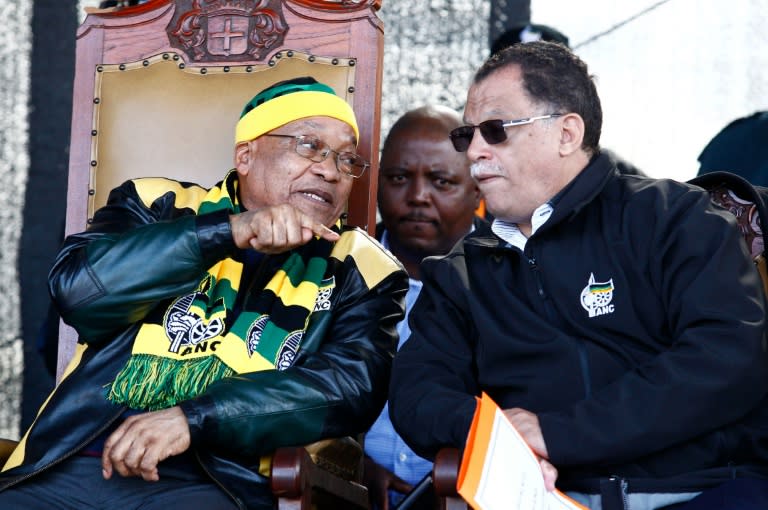 South African President Jacob Zuma (L) talks with Daniel Alexander "Danny" Jordaan, the current African National Congress (ANC) appointed Mayor of Port Elizabeth, during the ANC rally on July 23, 2016