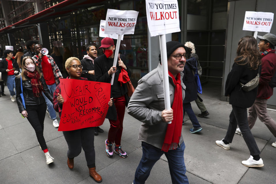 Hundreds of New York Times journalists and other staff picket outside the Times' office after walking off the job for 24 hours, frustrated by contract negotiations that have dragged on for months in the newspaper's biggest labor dispute in more than 40 years, Thursday, Dec. 8, 2022, in New York. (AP Photo/Julia Nikhinson)