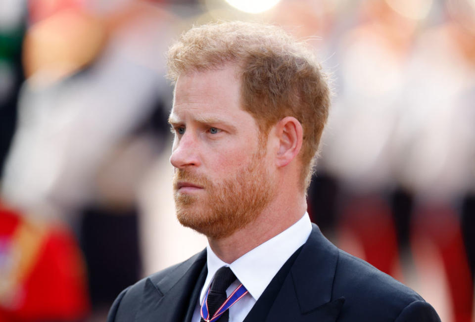 Prince Harry tears up during the Queen's procession. 