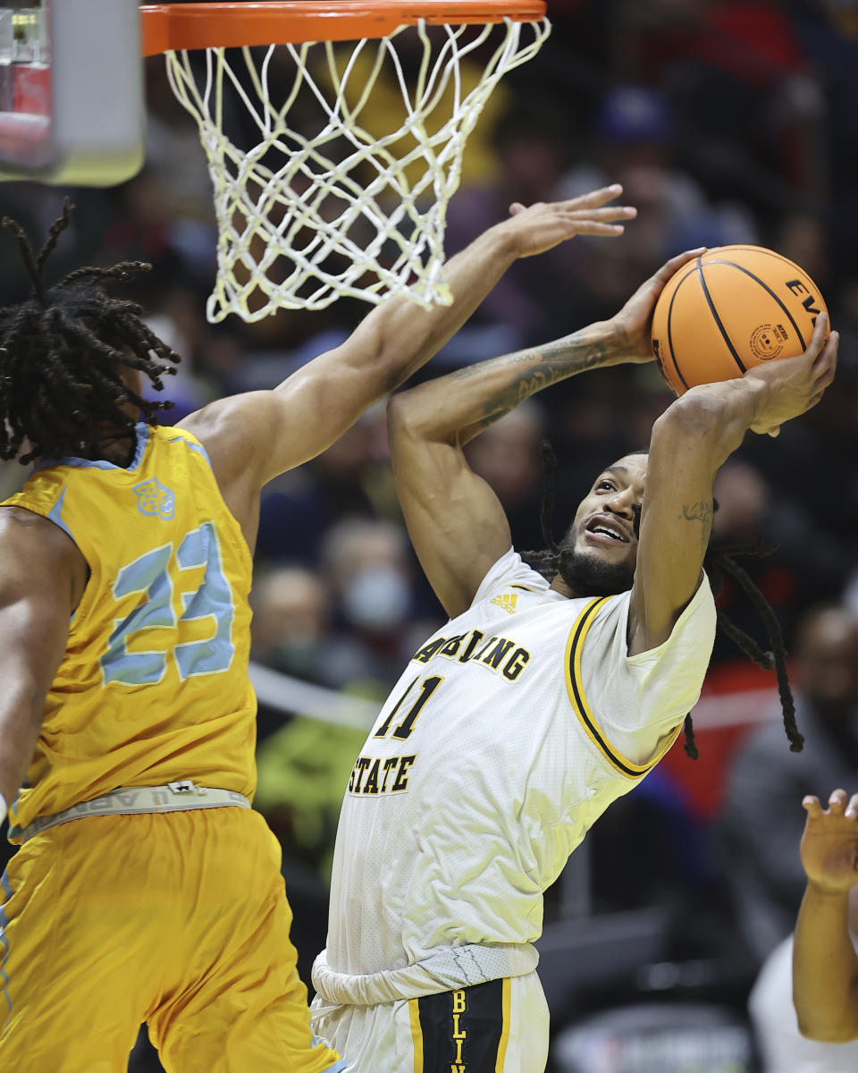 Grambling State guard Jourdan Smith (11) shoots against Southern guard Bryson Etienne (23) in the first half of the NBA All-Star HBCU classic college basketball game Saturday, Feb. 18, 2023, in Salt Lake City. (AP Photo/Rob Gray)